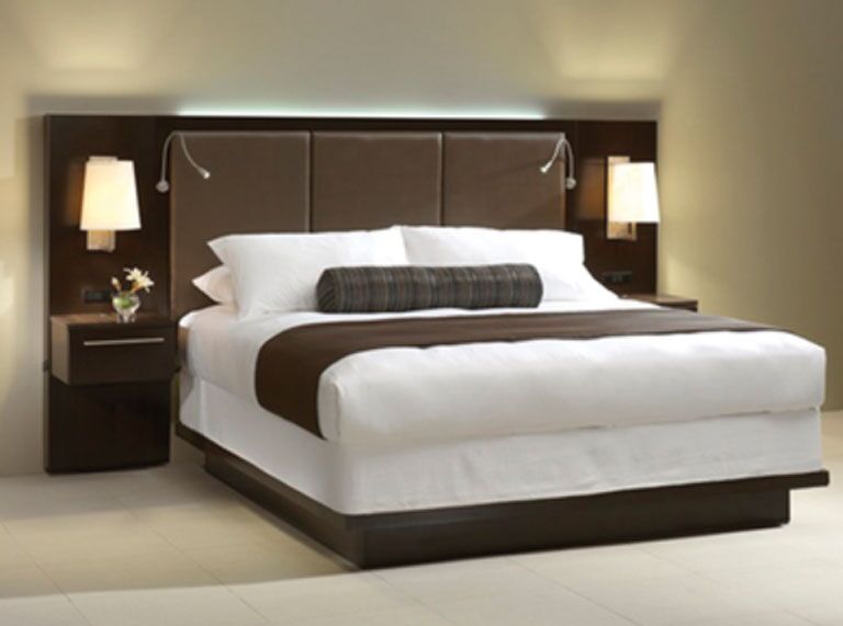 Hera Edenroc-LED light shown on a hotel headboard. A 1 watt personal reading light to keep from disturbing your partner. The Edenroc light i