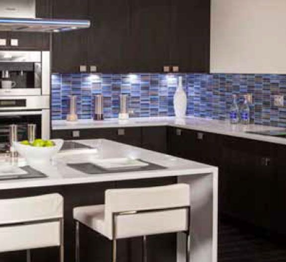 Another example of fixed under cabinet lights in a kitchen to provide extra light on your countertop, and to accent items you choose to leav