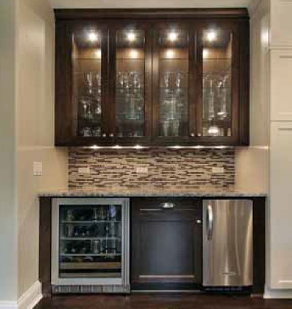 We are not certain which Hera lights are in this photo. The four glass doors have one spotlight centered per door. But under the cabinet it 