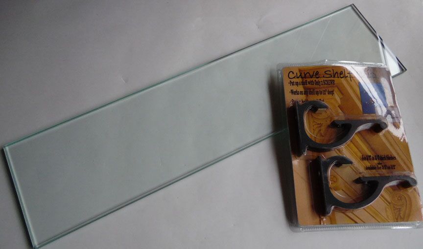 Expo Design 8 inch deep Curve Clip Kit. Composed of a pair of Curve Clips and a piece of 3/8" thick tempered glass in a 8" depth. Kit and glass length choices: